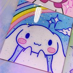 three different colored cards with an image of a unicorn and a rainbow on them, all in pastel colors