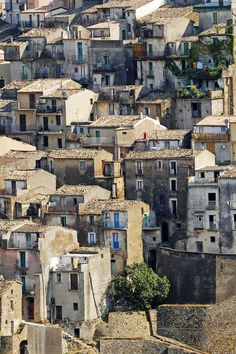 an aerial view of some very old buildings in the city with lots of windows and balconies