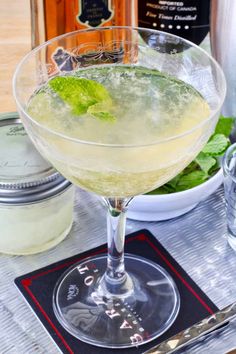 a drink in a glass on top of a table