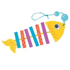 a yellow fish with blue eyes is hanging from a string