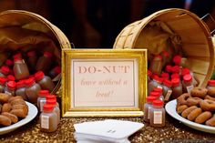 donuts are sitting on plates in front of two wooden baskets and a sign that says do - nut leave without a treat