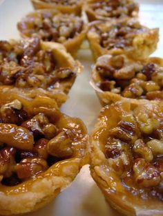 several pecan pies are arranged on a white plate