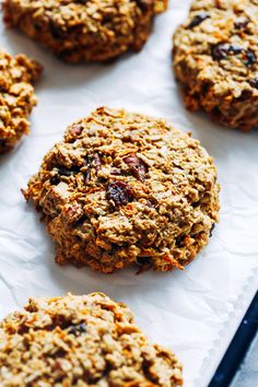 several oatmeal cookies sitting on top of a baking sheet