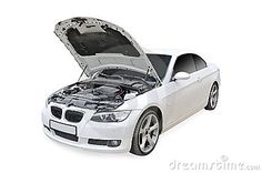 a white bmw car with its hood open