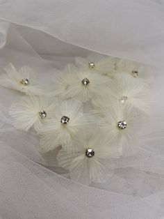 Description: Pleated organza 3D lace applique, crystal beaded bodice applique for wedding dress, flower girl dress, earring clip design, Millinery ◆ This listing is for 5 Pcs / 10 Pcs / 15 Pcs ◆ Width: About 5 cm (1.97'' ) ◆Application: Glue on / Sew On organza flower patch ◆ These are lovely for decorating your dress, boutique accessories, doggies, craft, hat, bag, any sewing etc... For more quantity, please feel free to convo me for custom listing Thank you for stopping by my store. ♡ ♡ Elegant White Embellished Tulle Fabric, White Embellished Tulle Fabric For Party, White Organza Tulle Fabric With Floral Applique, White Floral Tulle Fabric, Pleated Organza, Bodice Applique, Strawberry Dress, Clip Design, Organza Flowers