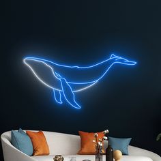 a living room filled with furniture and a neon dolphin wall decal