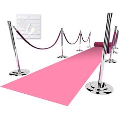 a pink carpet with barriers and rope