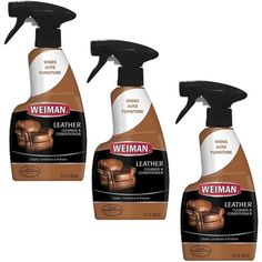 three bottles of leather cleaner sitting next to each other