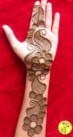 the hand is decorated with intricate designs