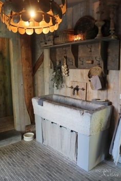 an old fashioned sink in a rustic bathroom