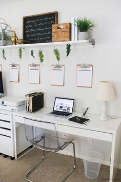 a white desk topped with a laptop computer