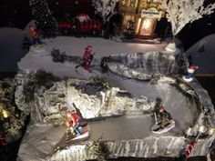 a christmas scene with people skiing and snowboarding in front of a lit up house