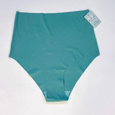 These ultra HIGH RISE briefs are seamless and SO COMFY - the stretchy fabric is breathable and moves when you do! Our customers love them - once you try these undies you'll be ruined for all others! This is a NEW style for us, it is a true HIGH rise (above the belly button) for full coverage. "Cheeky" cut across the bum Four Colours to Choose from Pairs well with our Katie Em Wireless Bras! Say no to VPL (visible pantie lines) with these amazing undies! 85% Polyester 15% Elastane Gusset 100% Cotton * Wash Cold, Hang dry. * When between sizes, size down as they do tend to relax with time. Do not size up. FINAL SALE. Blue Stretch Smoothing Bottoms, Blue Stretch Bottoms With Smoothing Detail, Compressive Seamless Blue Bottoms, Compressive Seamless Green Bottoms, Blue Stretch Seamless Bottoms, Compressive Seamless Blue Swimwear, Blue Compressive Seamless Swimwear, Blue Bottoms With Seamless Construction And 4-way Stretch, Blue Seamless Stretch Bottoms