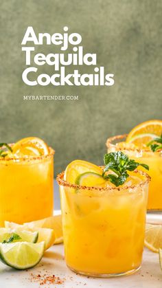 two glasses filled with orange tequila cocktails and garnished with lime