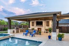 an outdoor living area with a pool and grill