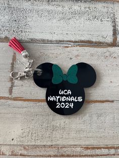 Mickey inspired black acrylic keychain, permanently engraved with a premium vinyl bow in your teams color.  Back can be engraved with your team and Athletes name. Please note, tassels do not come in gold or silver. All bows will be holographic or glitter. Please message for any special requests.  Please message me through Etsy or email me at sparkettedesigns@gmail.com to customize with names, colors and sport. Customizable Black Keychains For Personalized Gifts, Customizable Black Keychain For Personalized Gift, D2 Summit, Personalized Bag Tags, Les Arcs, Metal Keychain, Acrylic Keychain, Black Acrylic, Black Acrylics