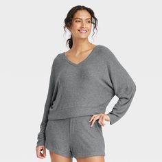 Stay effortlessly comfortable as you lounge around the house in this Cozy Ribbed Pullover from Auden™. Made from lightweight, super-comfy soft-brushed rib fabric with spandex, this long-sleeve pullover top hits at the hip. Designed with a V-neck and a relaxed fit, it's sure to be your new fave lazy-day pick. Auden™: Comfort true to every shape & hue. Comfy Ribbed Loungewear Sweater, Snug Solid Sweater For Loungewear, Snug Sweater With Ribbed Cuffs For Loungewear, Relaxed Fit Comfortable Sweater For Loungewear, Comfortable Relaxed Fit Sweater For Loungewear, Cozy Fit Soft Knit Comfortable Top, Comfortable Soft Knit Cozy Fit Top, Comfortable Soft Knit Cozy Top, Comfortable Cozy Fit Soft Knit Top