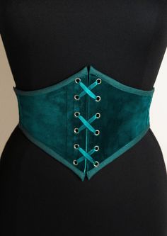 Do you like corsets but also like feeling comfortable in your clothes? This belt is made for you! This is an elastic waist cincher, made of quality duck blue velvet. Steel bones on the front of the belt provide support and give the illusion that it is a real corset. The sturdy elastic that makes up the back of this accessory provides greater sheathing than a classic belt and will adapt perfectly to your size. Possibility of choosing this model with braid (on request) or only with a cotton border Fitted Corset Belt For Costume, Velvet Underbust Corset, Teal Corset, Duck Blue, Classic Belt, Corset Belt, Waist Cincher, Suspender Belt, Fantasy Fashion