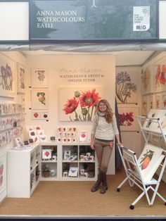 a woman standing in front of a store display