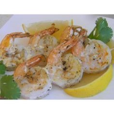 shrimp with lemon wedges and parsley garnish