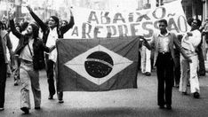 black and white photo of people marching down the street