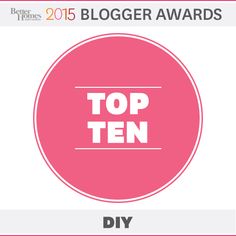 the top ten blogger award is displayed in front of a pink circle with white lettering