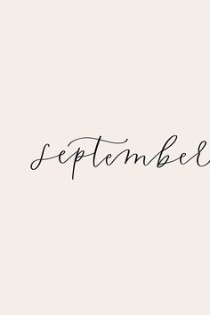 the word september written in cursive ink