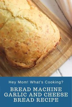 a loaf of bread sitting on top of a cutting board with the words, hey mom what's cooking? bread machine garlic and cheese bread recipe