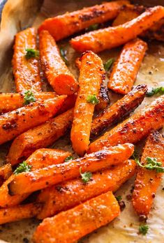 baked carrots with herbs and seasoning in a pan