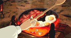 a person holding a spoon over some food in a pan with bacon and eggs on it