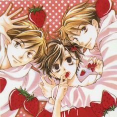 two children laying in bed with strawberries on their backs and one holding the head of another child