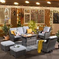 an outdoor living room decorated with christmas lights