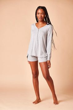 Ruqayyah is 5'9" Spring Henley With Relaxed Fit For Loungewear, Spring Henley In Relaxed Fit For Loungewear, Fall V-neck Sleepwear For Lounging, Relaxed Fit Henley For Spring Loungewear, Spring Long Sleeve Henley For Loungewear, Tulip Shorts, Henley Long Sleeve, Women's Henley, Fabric Patterns Design