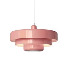 a pink pendant light hanging from a ceiling