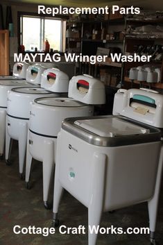 several coolers are lined up in a room with the words replaced parts maytag wrringer washer