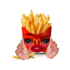 a woman with her face painted like a mcdonald's girl holding french fries in front of her face