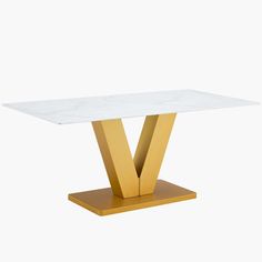 a white table with gold legs and a marble top on a wooden base, against a white background