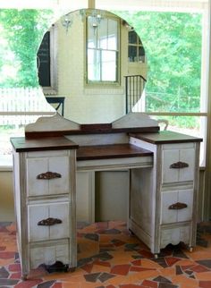 a desk with a mirror on top of it