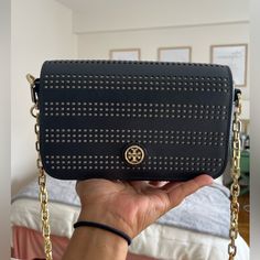 Tory Burch Cross Body Bag For Sale. Black And Gold, With Gold Chain On Strap. Lightly Used Dressy Crossbody Bag, In Great Condition! Looks Brand New And Is Gorgeous. A Bag With A Lot Of Space On The Inside, Due To Its Boxy Shape It Can Fit A Lot In There! Also A Flat Pocket On The Back Of The Bag. Tory Burch Bag, Black Cross Body Bag, Cross Body Bag, A Bag, Black And Gold, Body Bag, Gold Chain, Bag Sale, Cross Body