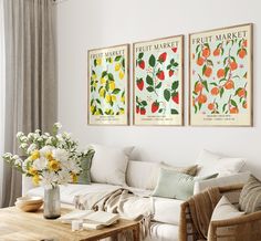 a living room filled with furniture and flowers on top of a wooden table next to a window