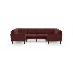 a red sectional couch with wooden legs and armrests on an isolated white background