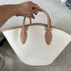 Brand New Never Used. Canvas Fabric With Leather Handles And Pipings. Chic Brown Canvas Bag With Detachable Handle, Beige Tote Bucket Bag For Errands, Classic Beige Bucket Bag For Shopping, Chic Beige Leather Canvas Bag, Beige Bucket Canvas Bag With Leather Handles, Beige Canvas Bag With Leather Top Handle, Beige Bucket Bag With Detachable Handle For Shopping, Chic Bucket Bag With Leather Trim, Chic Brown Canvas Bag With Double Handle