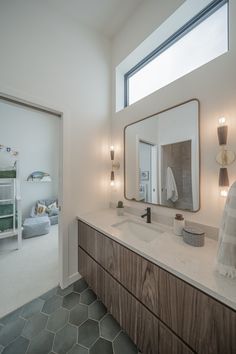 a bathroom with two sinks and a large mirror