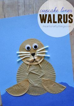 an animal made out of paper with the words walrus on it and a blue background