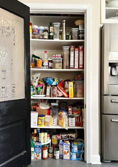 an open pantry door with food in it