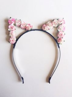 Adorable floral cat ears featuring small pink/white paper roses. Roses are attached to wire 'ears' (front only) on a high quality metal headband that will stay in place until you take it off... Both, ears and headband, are covered with black ribbon. One size fits all. Item will be shipped 2 to 3 days after purchase. See more cat ears here: https://www.etsy.com/shop/VividBloom?section_id=17265338 Check out the variety of flower and feather headbands (and more) in my shop: https://www.etsy.com/sho White Cat Ears, Rose Headband, Cat Ears Headband, Metal Headband, Flower Halo, Fox Ears, Leather Headbands, Head Pieces, Floral Cat