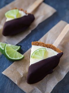 two pieces of food with limes and chocolate on them