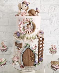 there is a large cake decorated with animals and flowers