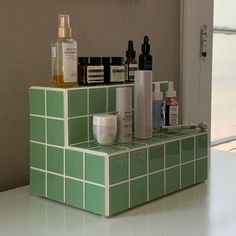 a counter with some bottles and containers on it