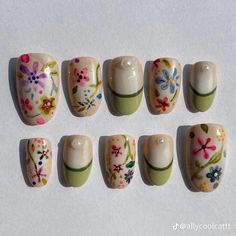 six different sized nails with flowers painted on them